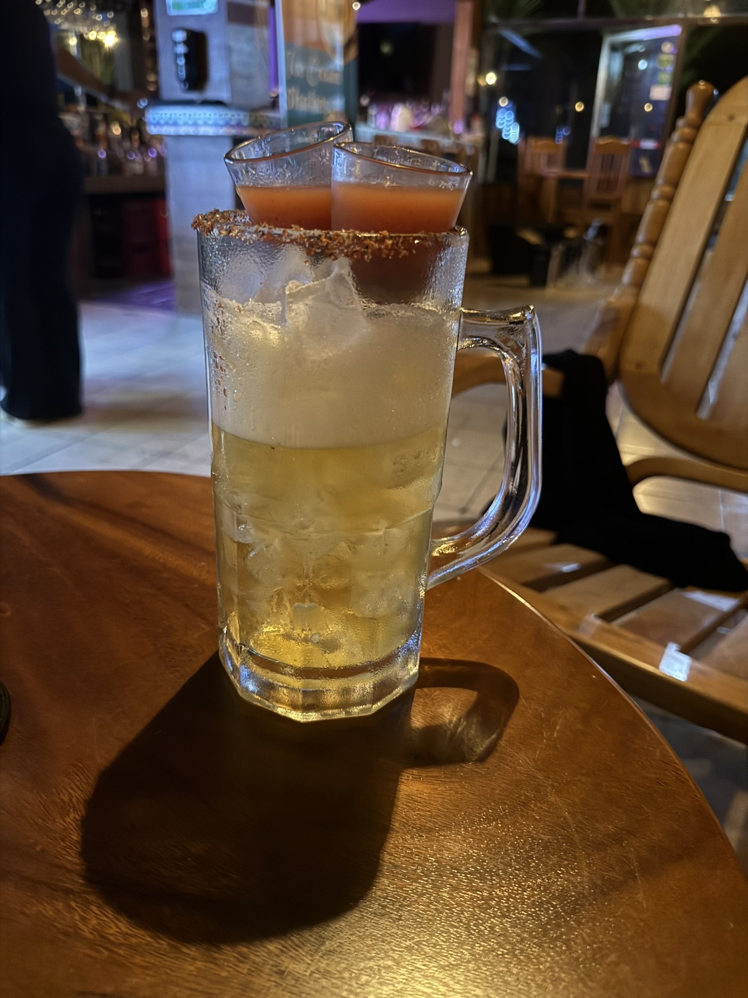 Frosty beer mug with a Tajín-rimmed shot